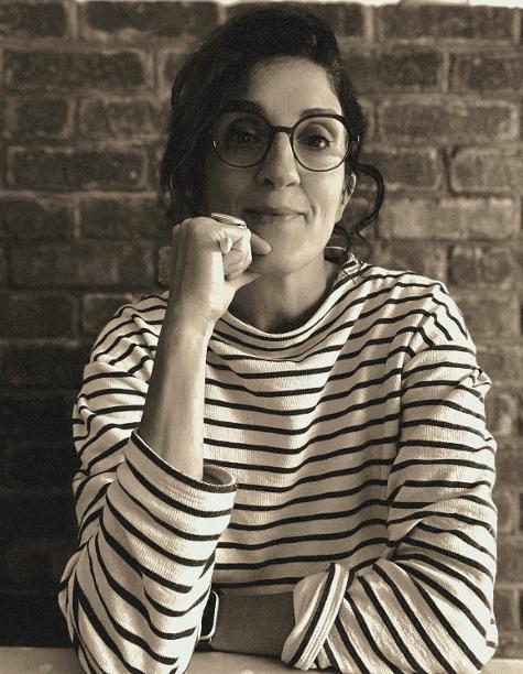 Planting Consultancy photo of Carol O’Sullivan with stripe top and reading glasses