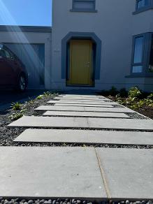 Ballinlough House Garden with limestone steps to front yellow door of house